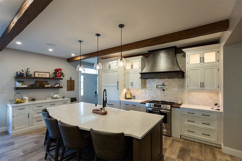 Custom Kitchens featuring a center island and elegant wooden beams in Newark, DE
