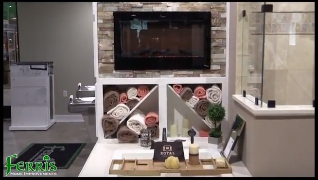Stylish bathroom with a fireplace and sink at Ferris Home Improvements Showroom in Newark, DE