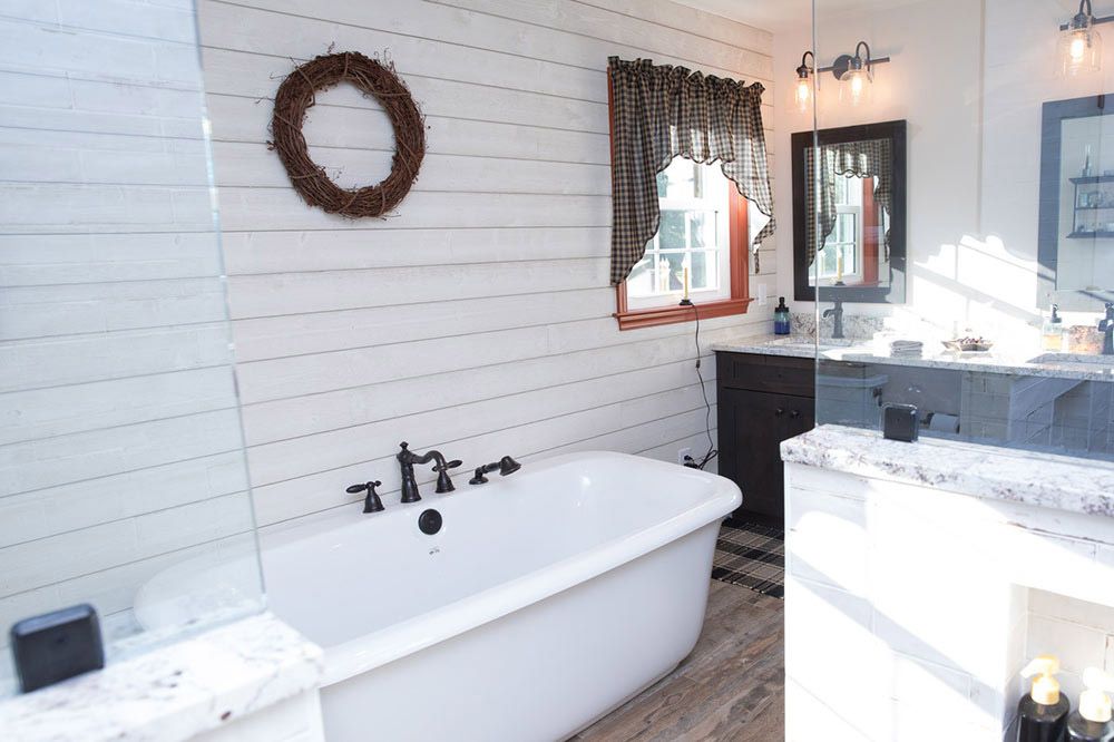 Bathroom with a stylish tub and sink, emphasizing a contemporary aesthetic in Delaware