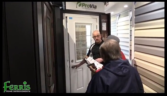 A man and woman discuss Touch and feel products in front of a door in Newark, DE