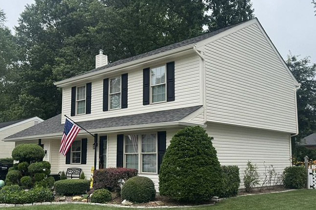 Outdoor living experience featuring a white pergola and chairs on a deck in Newark, DE