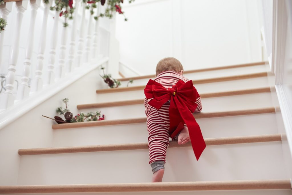 A baby climbing the stairs