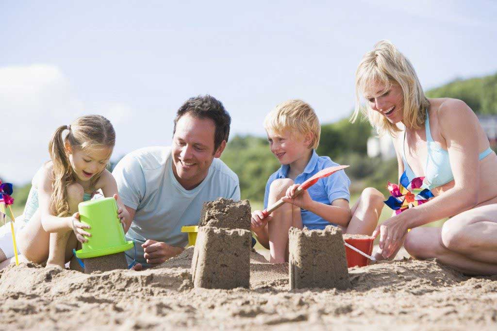 Family playing on a beach