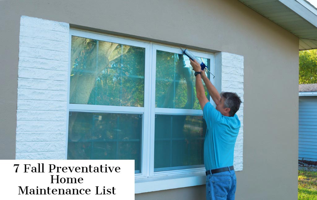 Man is repairing window