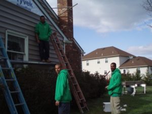 workers fixing home roof