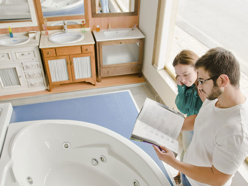 two persons buying a bath tub