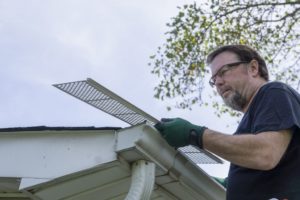 A men placing a roof