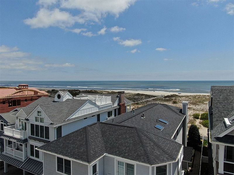 beach side houses with roofing