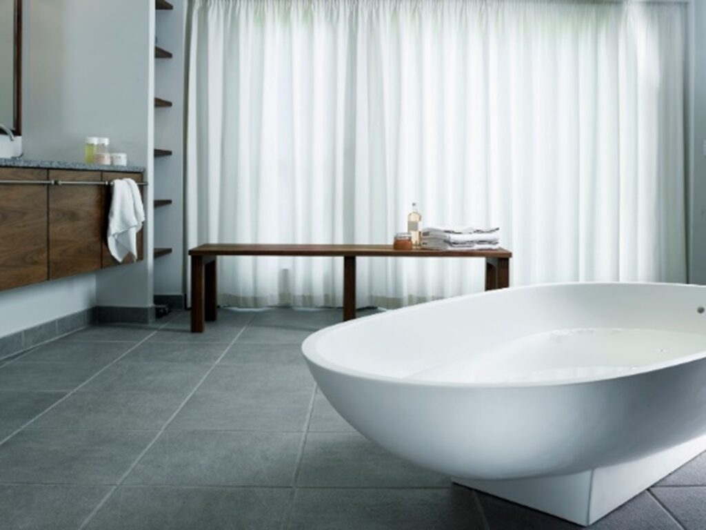 A white bathtub in a bathroom